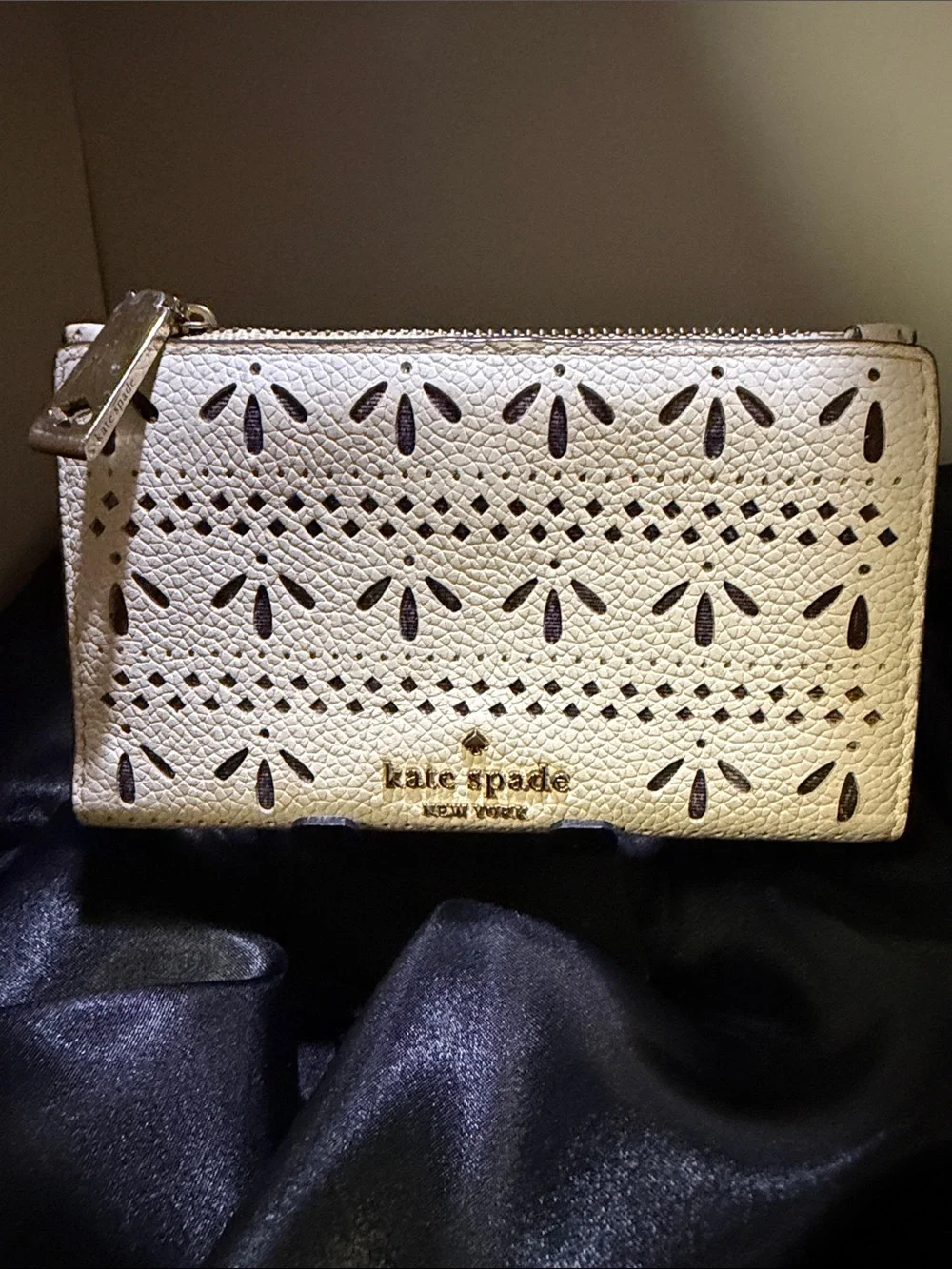 EUC Kate Spade White Perforated Leather Zip Wristlet with Gold Logo